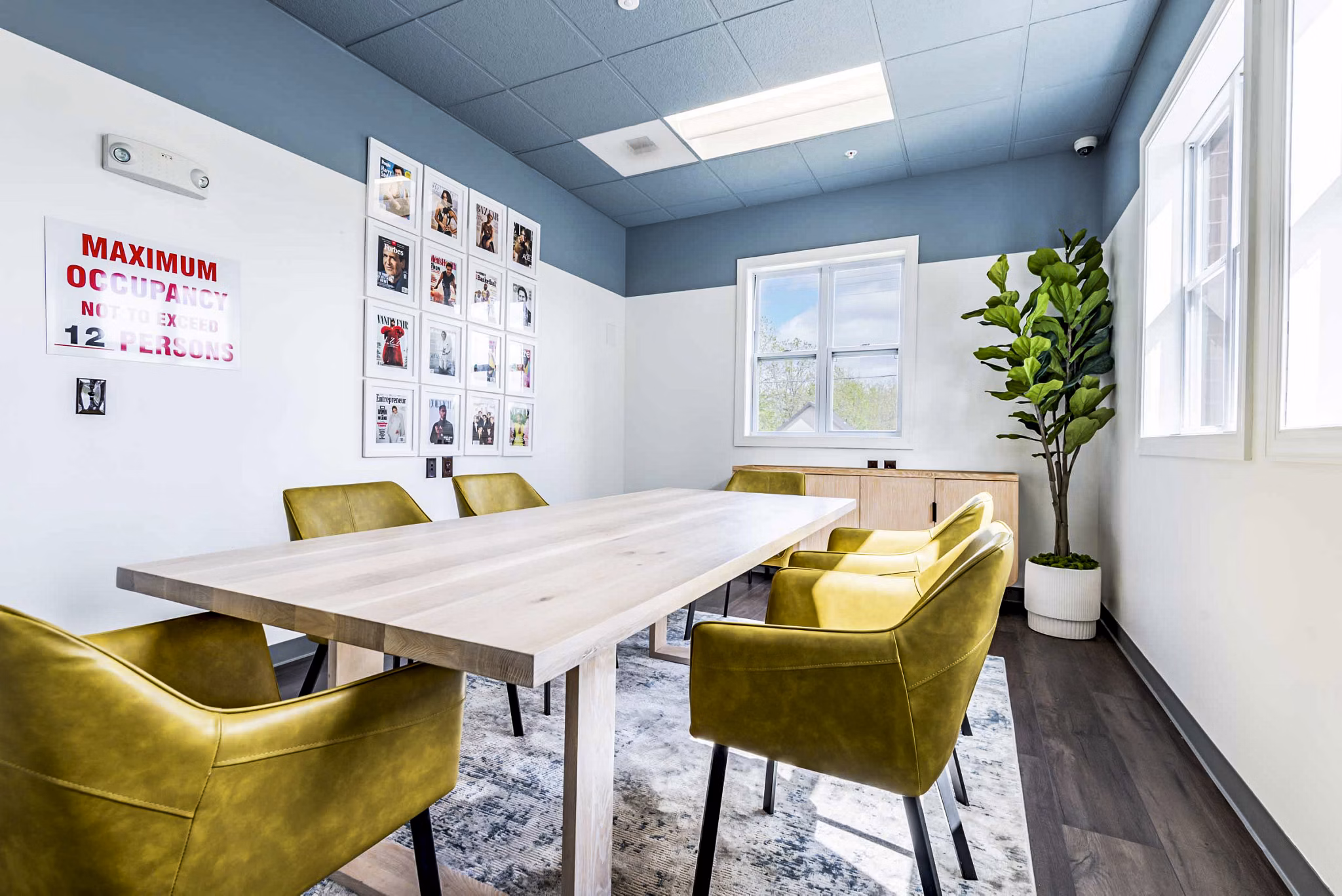 Clubhouse featuring modern design and cozy seating at University Village Apartments on Colvin