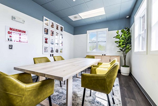 Clubhouse featuring modern design and cozy seating at University Village Apartments on Colvin