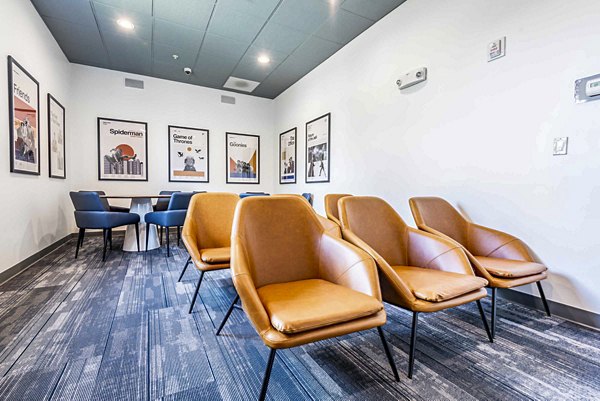 Clubhouse with modern design and cozy seating at University Village Apartments on Colvin