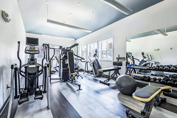 State-of-the-art fitness center with modern equipment at University Village on Colvin Apartments offering premium facilities for active lifestyles