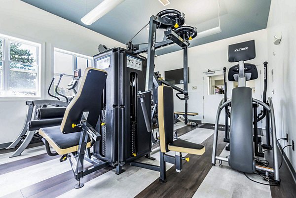 Fitness center at University Village Apartments featuring modern equipment and spacious workout areas