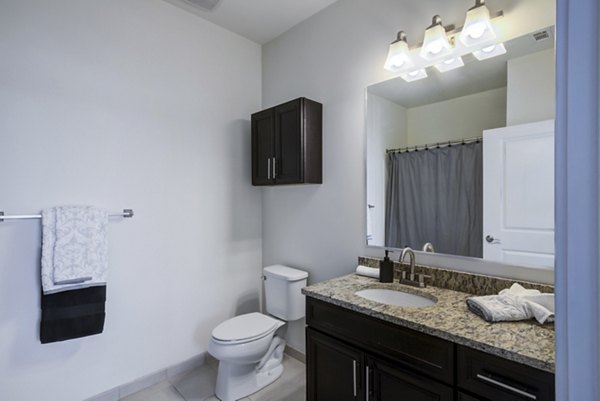 Modern bathroom with sleek fixtures at The Oaks on The Square Apartments