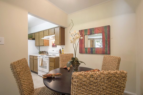 Spacious dining room with modern decor at Huntcliff Apartments, ideal for luxury living