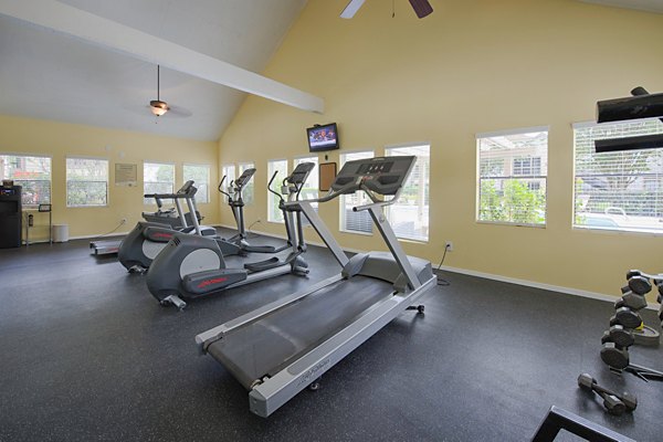 State-of-the-art fitness center with modern equipment at Huntcliff Apartments, ideal for active lifestyles in luxury living