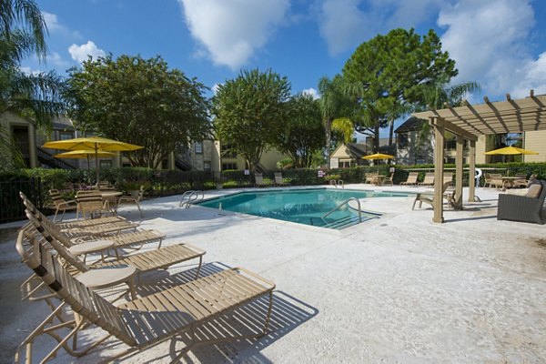 Resort-style pool with sun loungers at Huntcliff Apartments