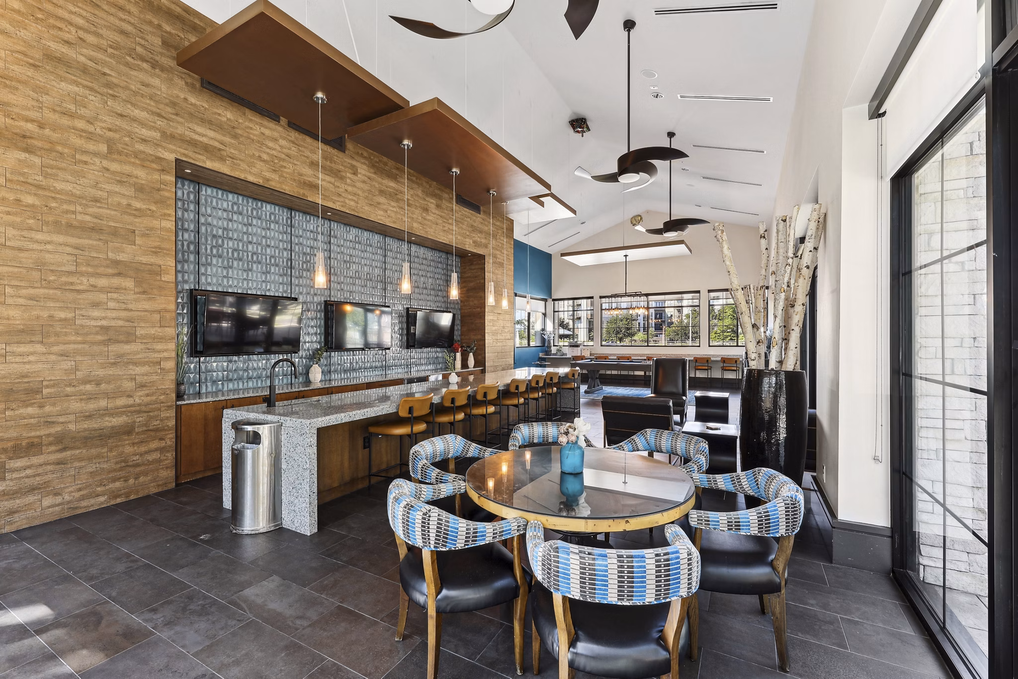 Dining room showcasing modern furniture and elegant lighting in The Michael at Presidio Apartments