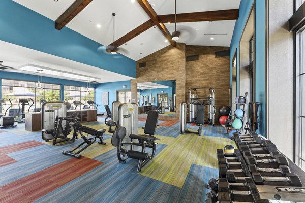 State-of-the-art fitness center with modern equipment at The Michael at Presidio Apartments
