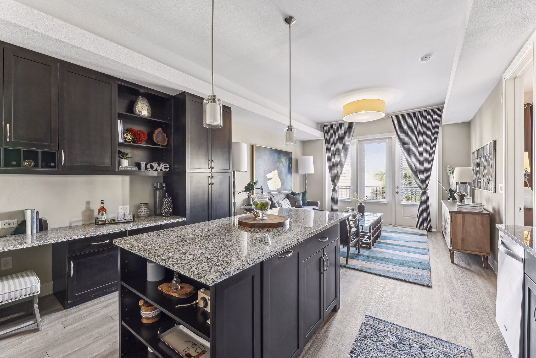 Modern kitchen with stainless steel appliances at The Michael at Presidio Apartments, a Greystar luxury apartment community