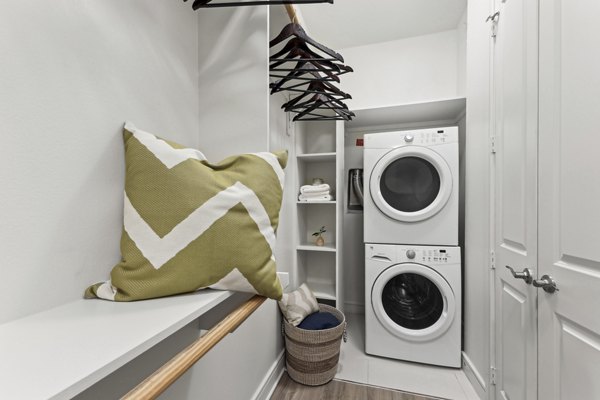 Laundry facility with modern machines at The Michael at Presidio Apartments offering convenient on-site amenities