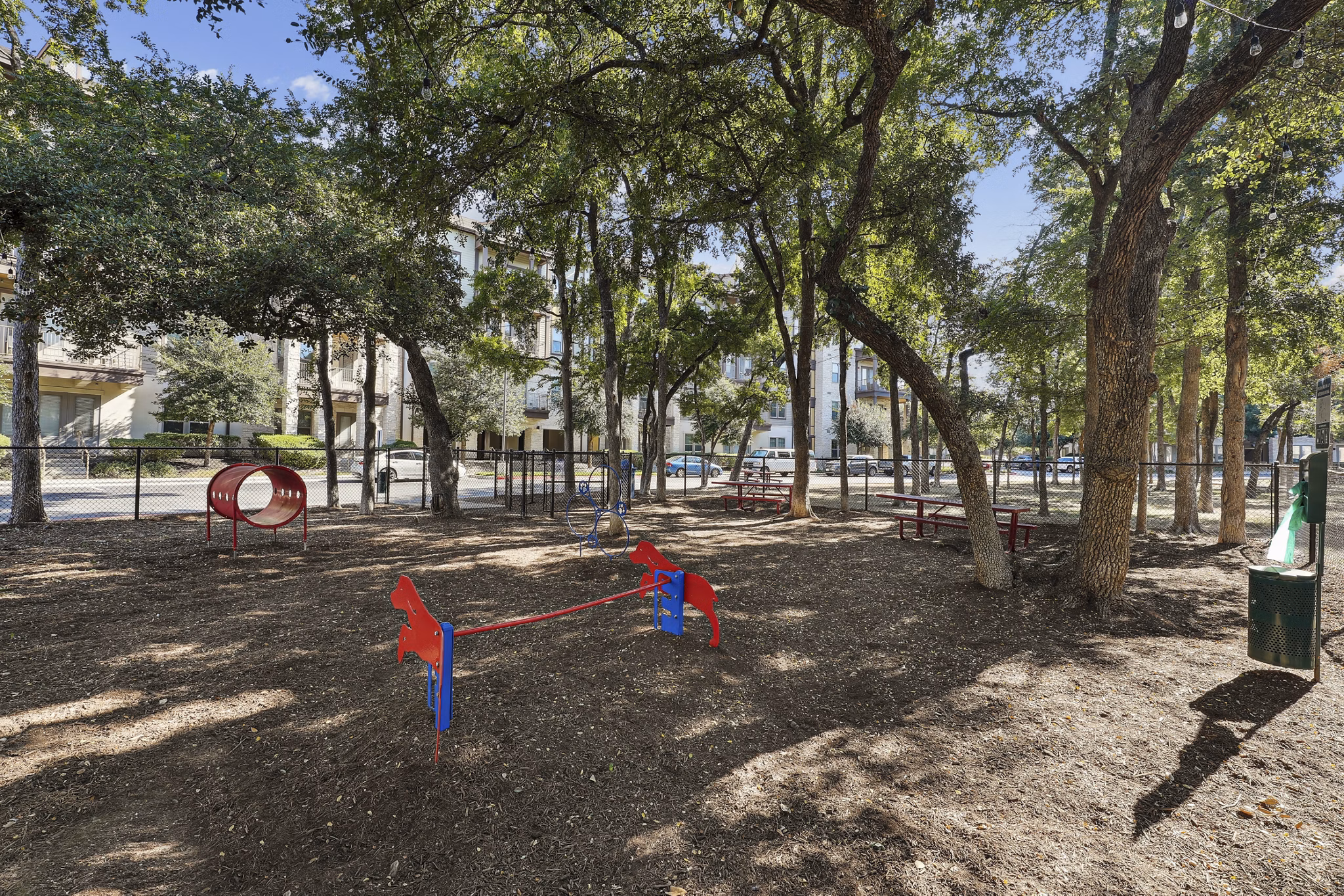 Playground at The Michael: Modern playground area with colorful equipment at The Michael at Presidio Apartments, perfect for luxury family living