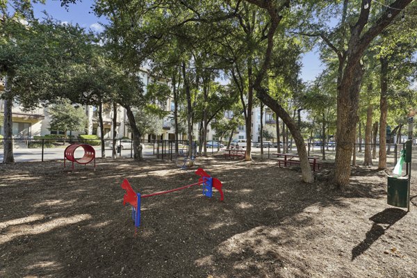 Playground at The Michael: Modern playground area with colorful equipment at The Michael at Presidio Apartments, perfect for luxury family living
