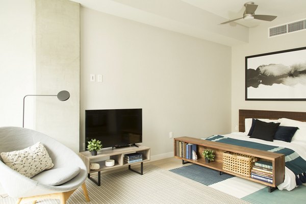 Luxurious bedroom featuring ocean views and modern dÃ©cor at Pierside South apartments