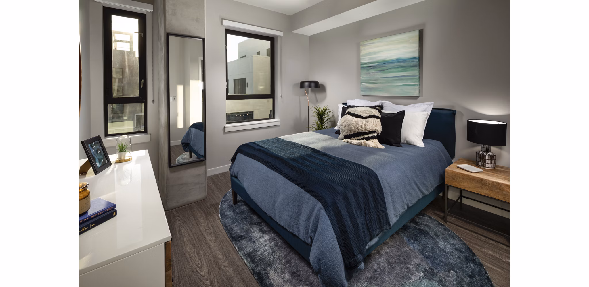 Elegant bedroom with ocean views at Pierside South Apartments, featuring modern furnishings and abundant natural light