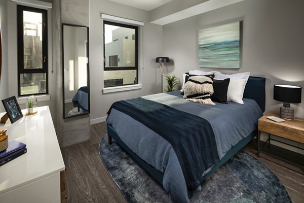 Elegant bedroom with ocean views at Pierside South Apartments, featuring modern furnishings and abundant natural light