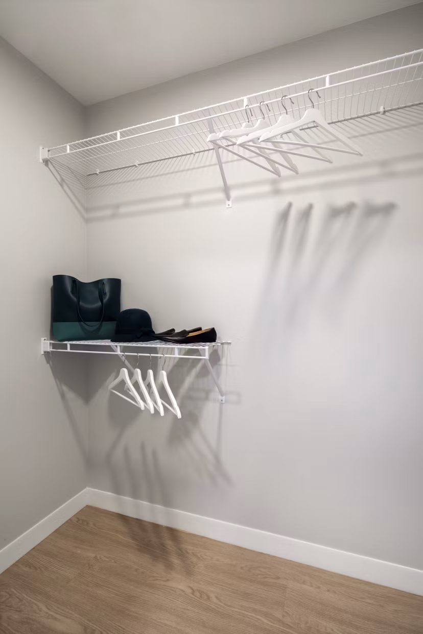 Walk-in closet with ample storage space at Pierside South Apartments