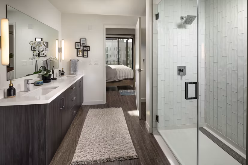 Pierside South Apartments: Elegant bathroom featuring modern fixtures and marble countertops