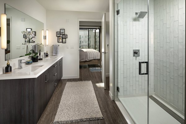 Pierside South Apartments: Elegant bathroom featuring modern fixtures and marble countertops