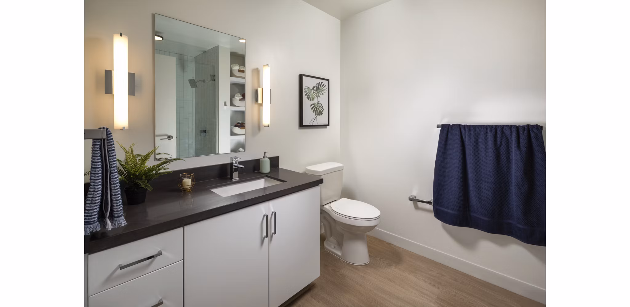 Bathroom with sleek fixtures and marble countertops at Pierside South Apartments