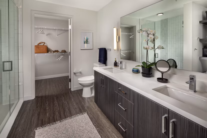Pierside South Apartments: Modern bathroom with sleek fixtures and elegant lighting