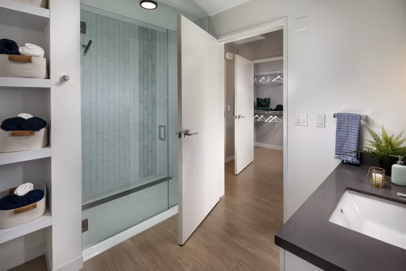 Modern bathroom with marble countertops and sleek fixtures at Pierside South luxury apartments