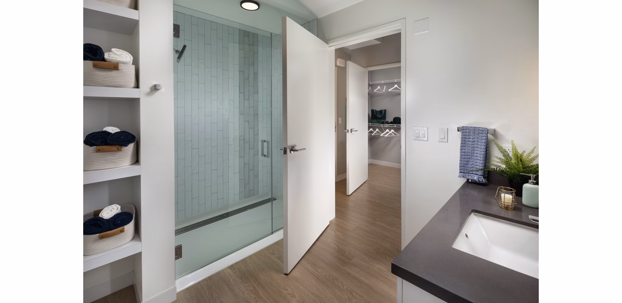 Modern bathroom with marble countertops and sleek fixtures at Pierside South luxury apartments