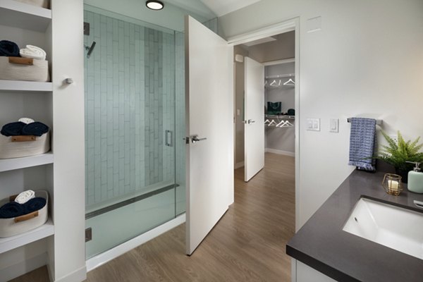 Modern bathroom with marble countertops and sleek fixtures at Pierside South luxury apartments