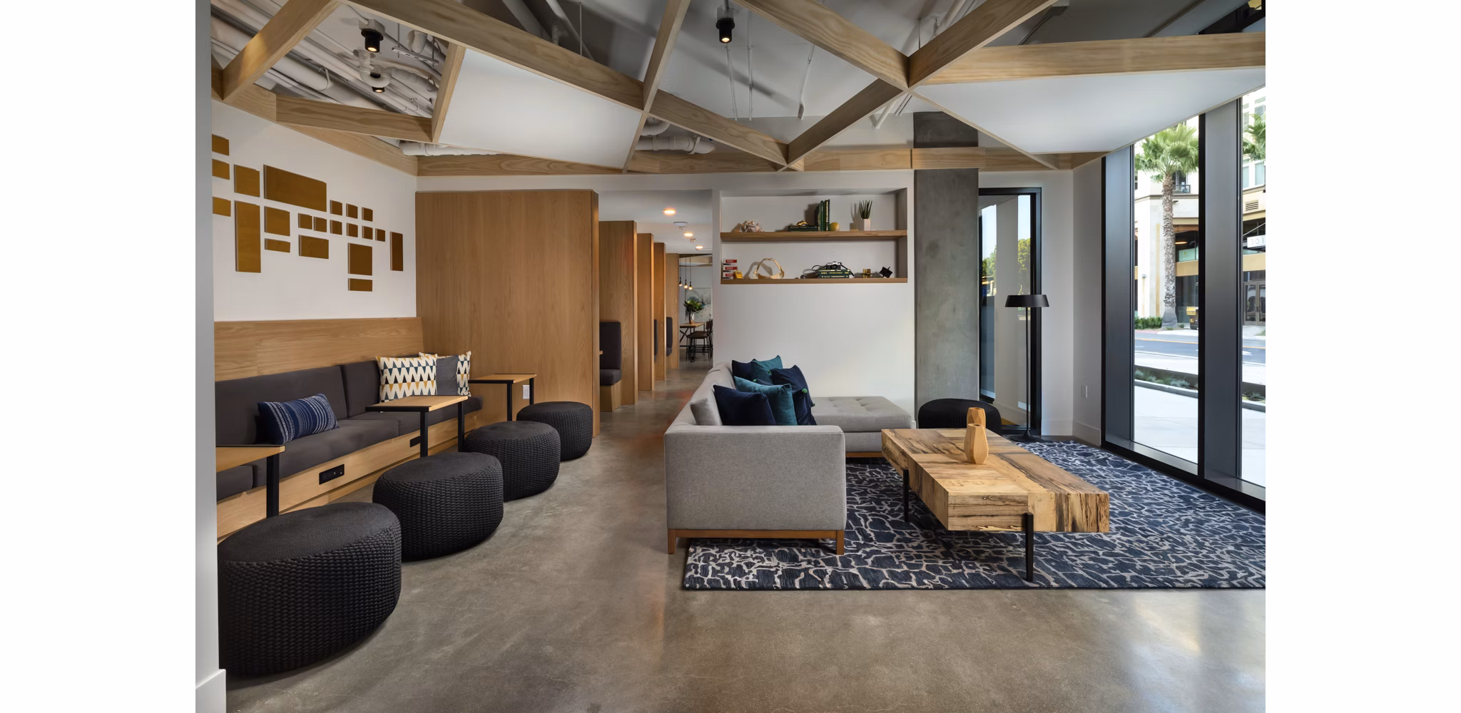 Pierside South Apartments: Stylish clubhouse with modern decor and seating areas near waterfront