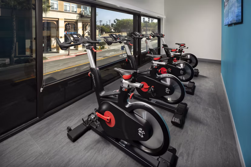 Modern fitness center with spin bikes at Pierside South Apartments, ideal for an active lifestyle
