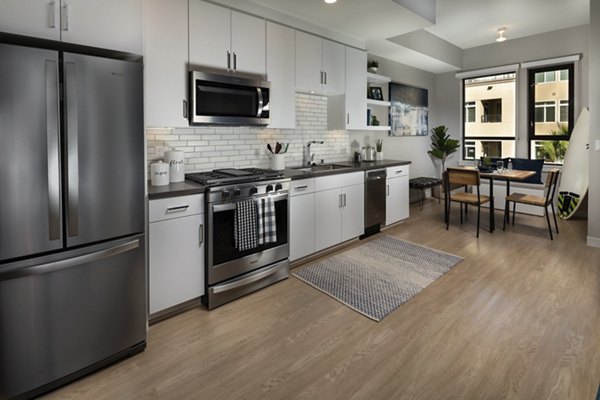 Modern kitchen with stainless steel appliances in Pierside South Apartments, Long Beach