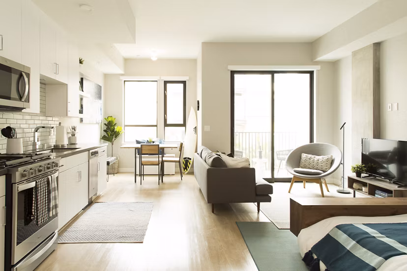 Living room with stylish decor at Pierside South featuring a cozy seating area and modern lighting