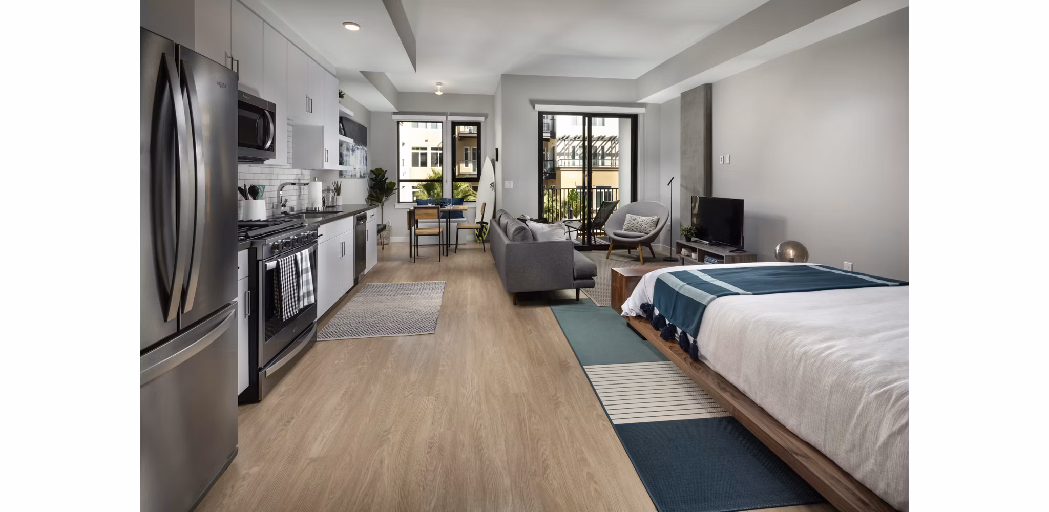 Spacious studio space with stylish living room at Pierside South Apartments, featuring modern design and comfortable seating arrangements