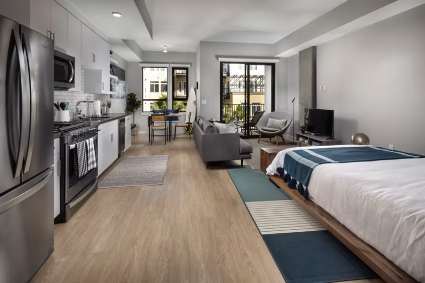 Spacious studio space with stylish living room at Pierside South Apartments, featuring modern design and comfortable seating arrangements