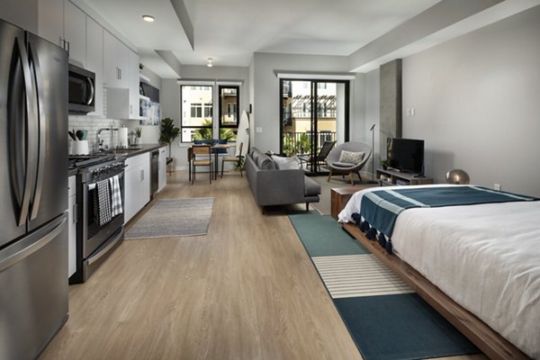Spacious studio space with stylish living room at Pierside South Apartments, featuring modern design and comfortable seating arrangements