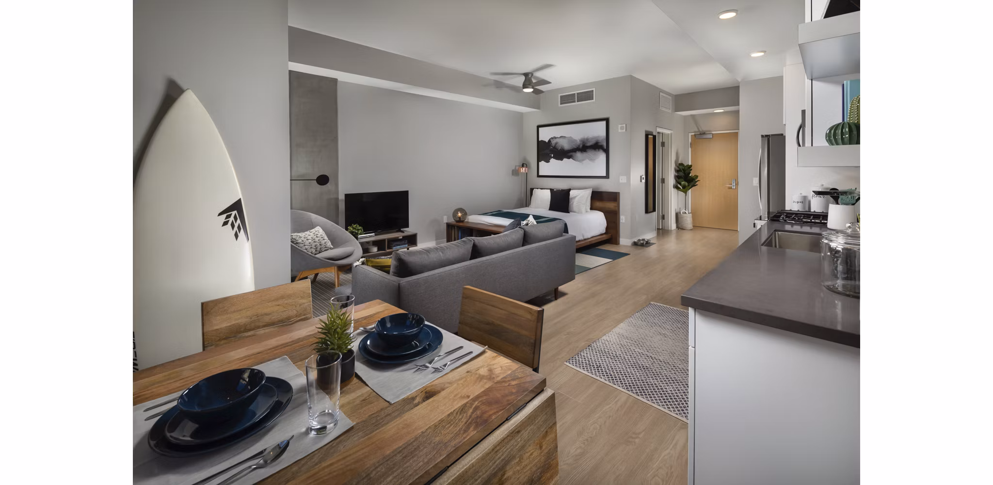 Cozy studio living room with modern decor at Pierside South Apartments, ideal for comfortable urban living in scenic settings
