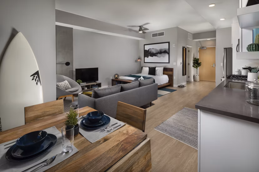 Cozy studio living room with modern decor at Pierside South Apartments, ideal for comfortable urban living in scenic settings