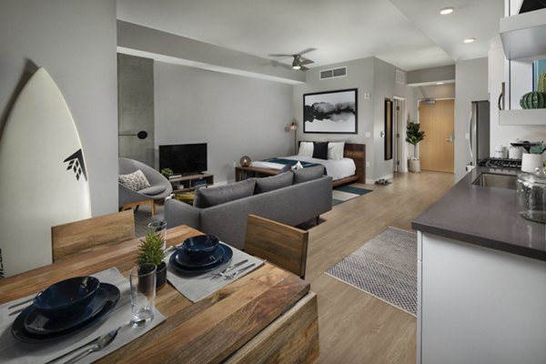 Cozy studio living room with modern decor at Pierside South Apartments, ideal for comfortable urban living in scenic settings