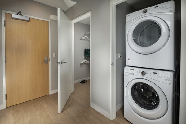 Washer and dryer in-unit at Pierside South Apartments offering convenience and modern living features in luxury settings