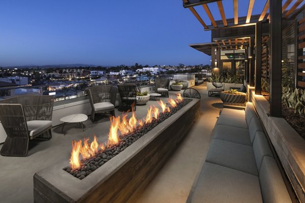 Pierside South Apartments: Relaxing patio area with outdoor seating near the waterfront, ideal for leisure and social gatherings