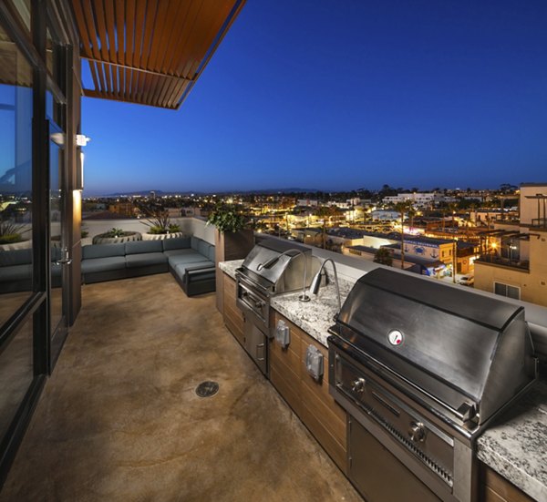 Patio with grills for summer dining at Pierside South Apartments