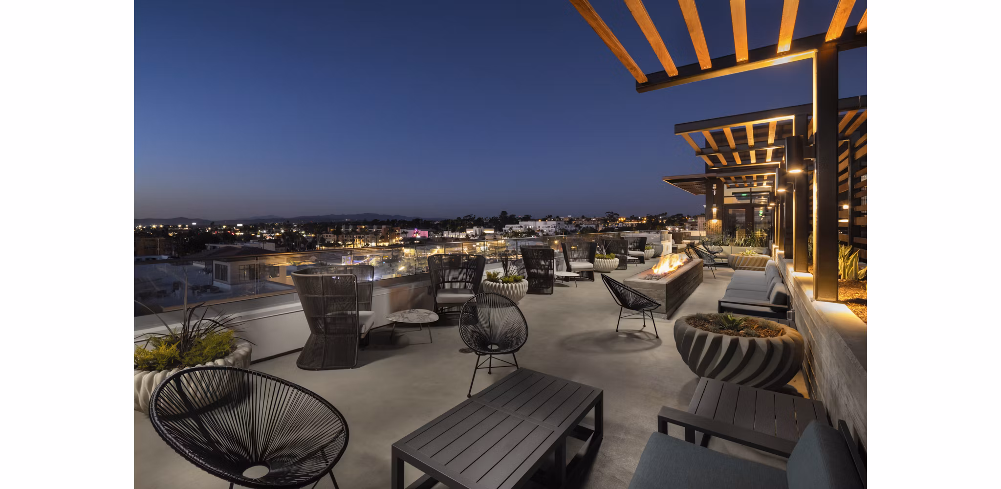 Patio area with cozy seating and ocean views at Pierside South Apartments Enjoy luxury living in a prime coastal location