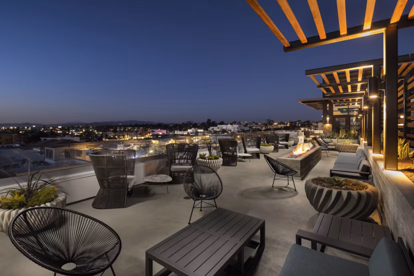 Patio area with cozy seating and ocean views at Pierside South Apartments Enjoy luxury living in a prime coastal location