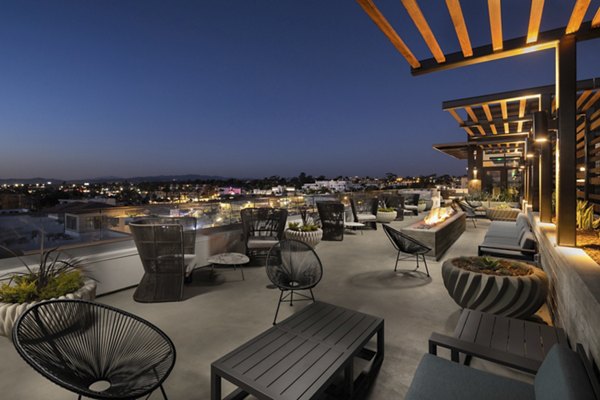Patio area with cozy seating and ocean views at Pierside South Apartments Enjoy luxury living in a prime coastal location