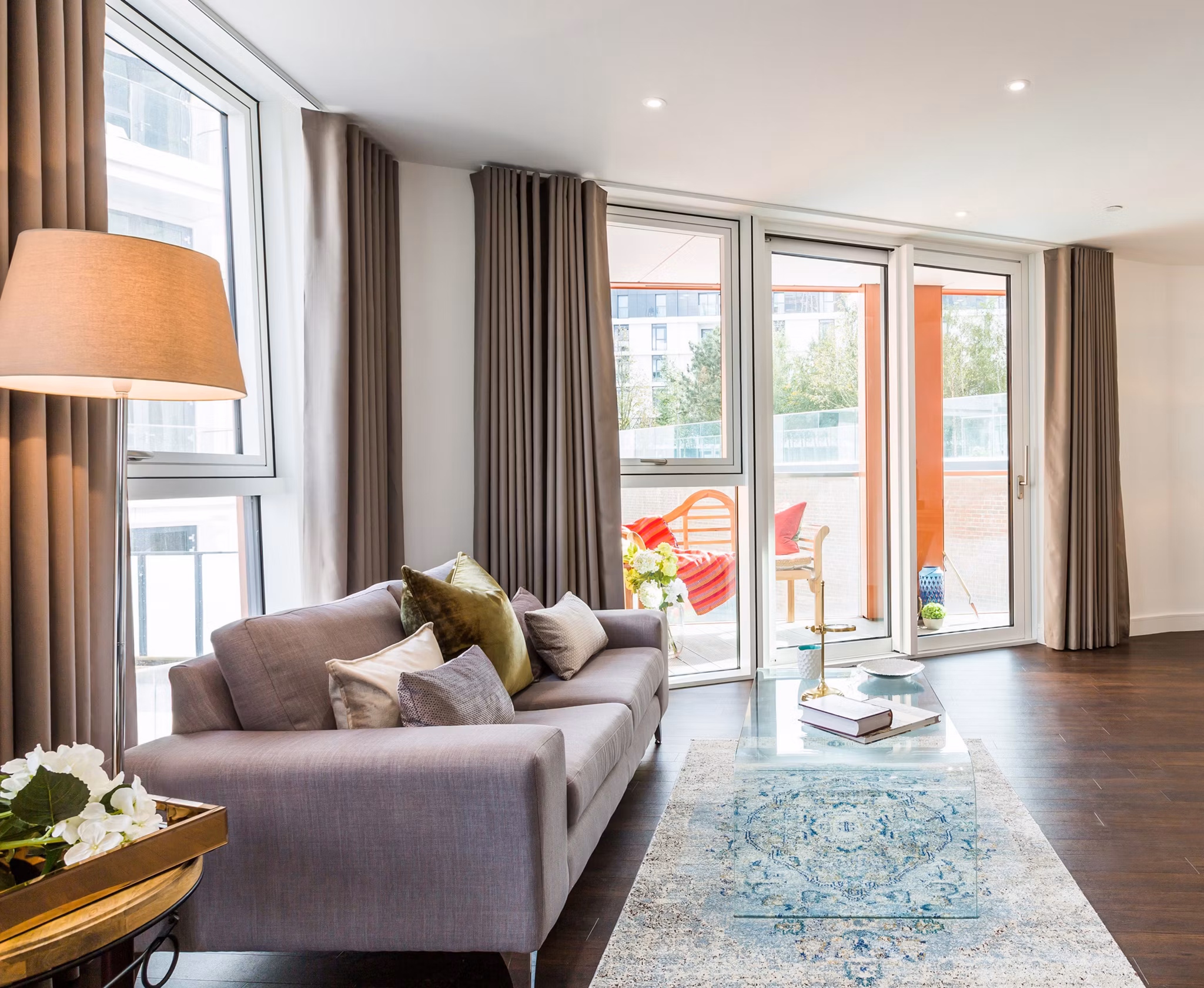 Elegant living room featuring modern decor and abundant natural light in Nine Elms luxury apartments