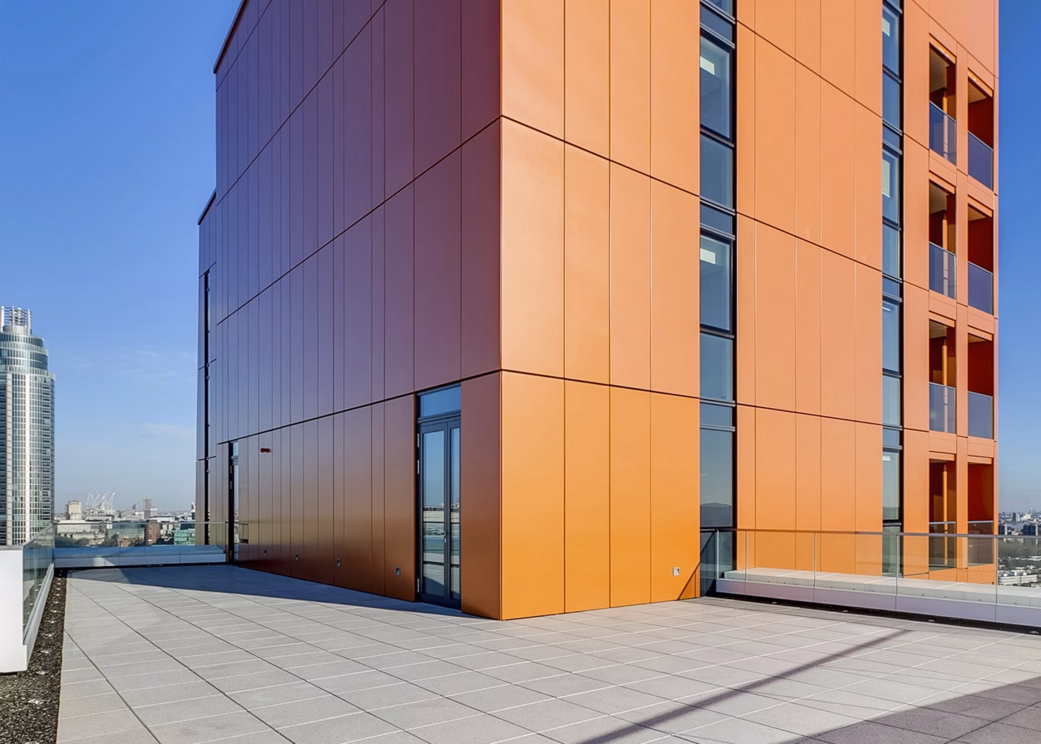 Modern patio with comfortable seating and garden views at Nine Elms luxury apartments