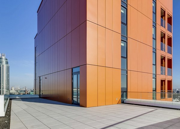 Modern patio with comfortable seating and garden views at Nine Elms luxury apartments
