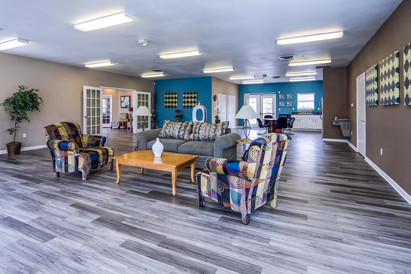 Clubhouse lobby featuring modern design and seating area at Allison Pointe Apartments