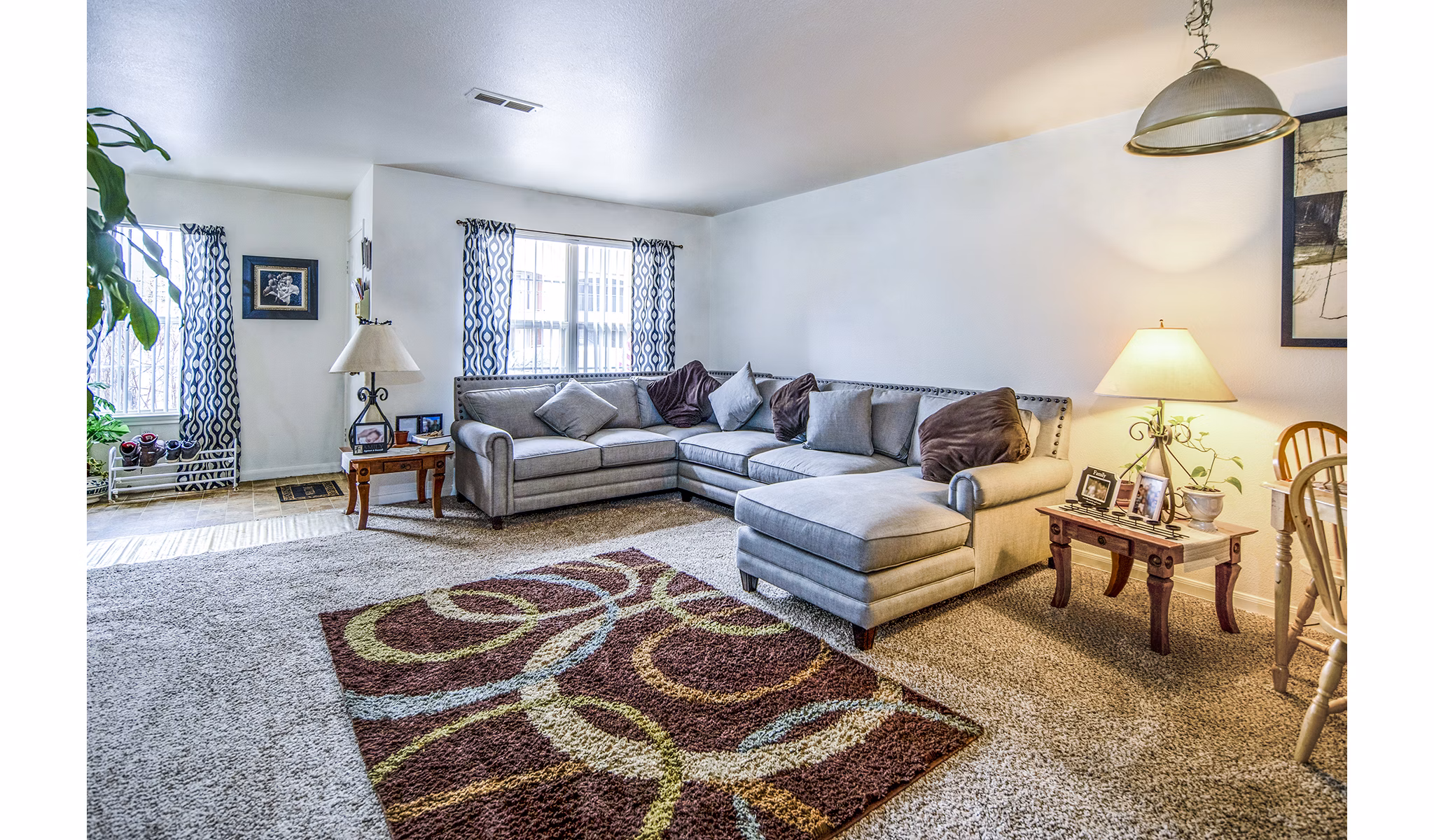 Spacious living room with contemporary furnishings in Allison Pointe Apartments