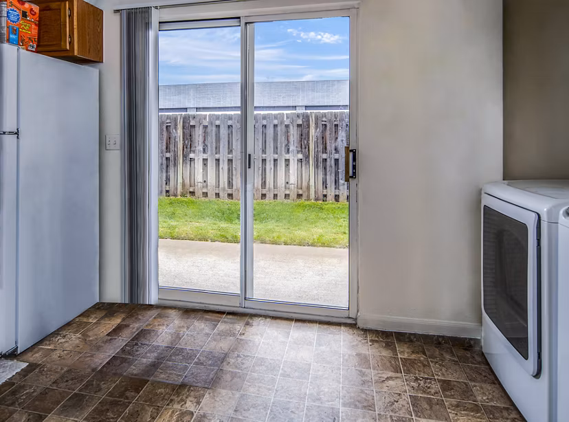 Modern laundry room with high-efficiency washers and dryers at Allison Pointe Apartments
