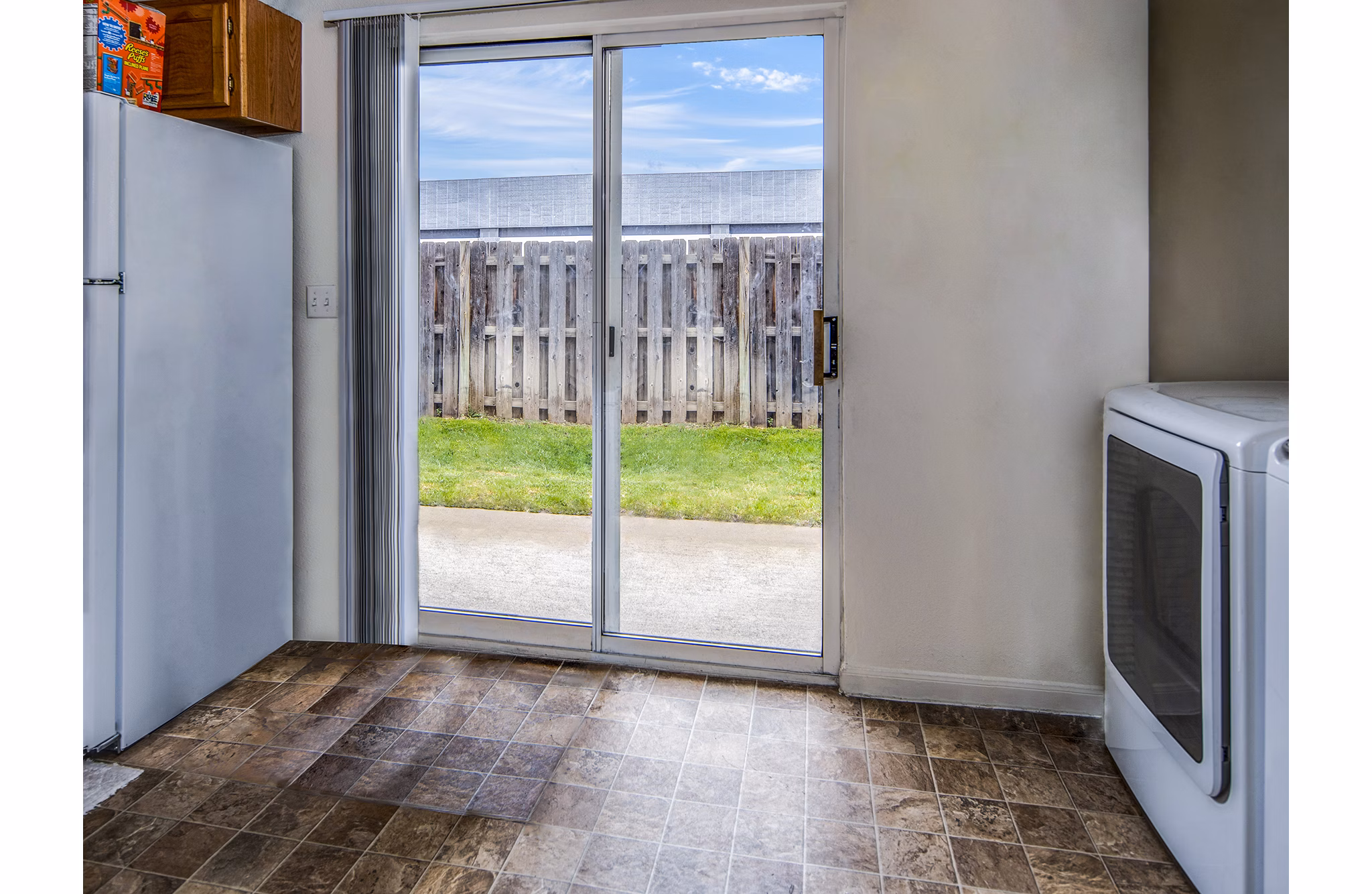 Modern laundry room with high-efficiency washers and dryers at Allison Pointe Apartments