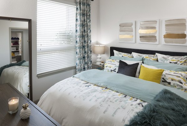 Bedroom at Alexan West Highland: Spacious room with contemporary design and large windows for natural light in luxury apartment